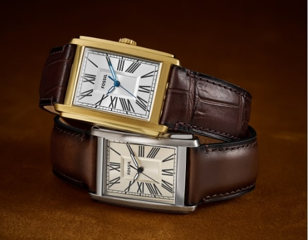 Two Carraway watches stacked on top of each other, featuring a gold-tone case and a silver-tone case.