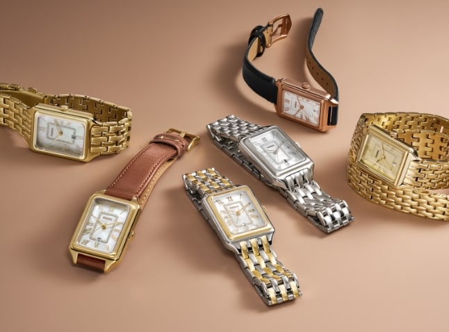 Sechs Uhren Raquel in verschiedenen Ausführungen, einschließlich Bändern in Goldfarben, Silberfarben und aus Leder.