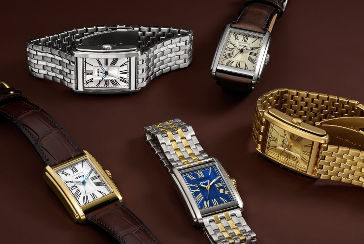 Fünf Uhren Carraway, einschließlich einer Version mit braunem Lederband, einer silberfarbenen Version, einer weiteren Option mit braunem Lederband, einer goldfarbenen und einer zweifarbigen Version.