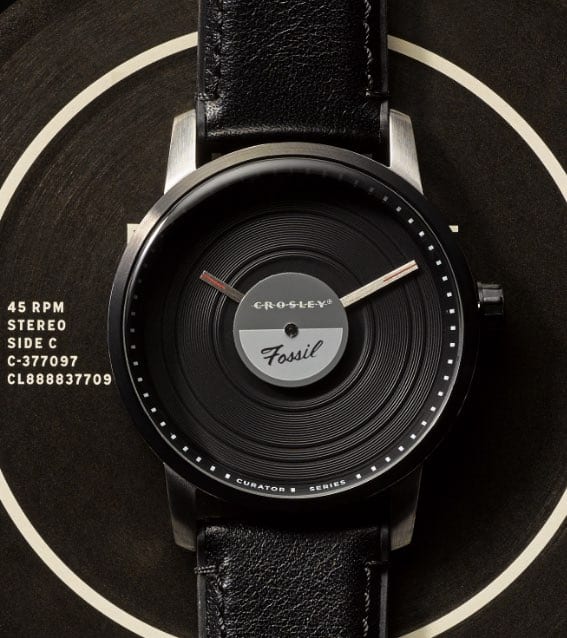 Crosley by Fossil watch on top of record covers.